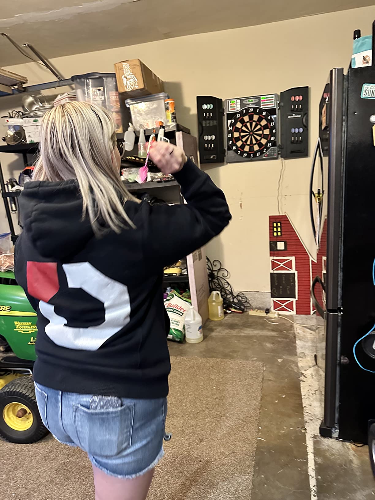 Arachnid Titanium 5400: 13.5” Target with Integrated Cabinet. Offers 38 Games, 316 Variations, Color LED Scoring, and Solo Play. Includes Double in/Out Modes for Competitive Game Room Fun. customer photo 2