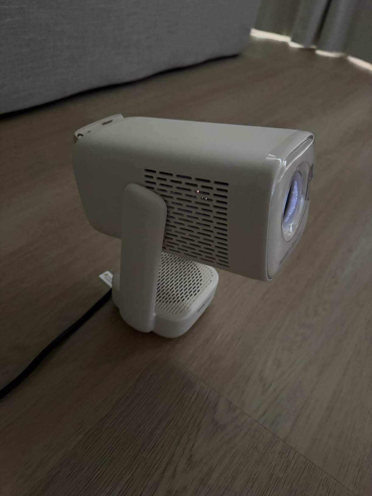 Aurzen Roku TV E1R Smart Portable Mini Projector with WiFi and Bluetooth | Roku TV Built-in, Upgraded Sound Base, 180° Rotation, Auto Vertical Keystone, Zoom, Portable for Home Movie/Bedroom/Outdoor customer photo 1
